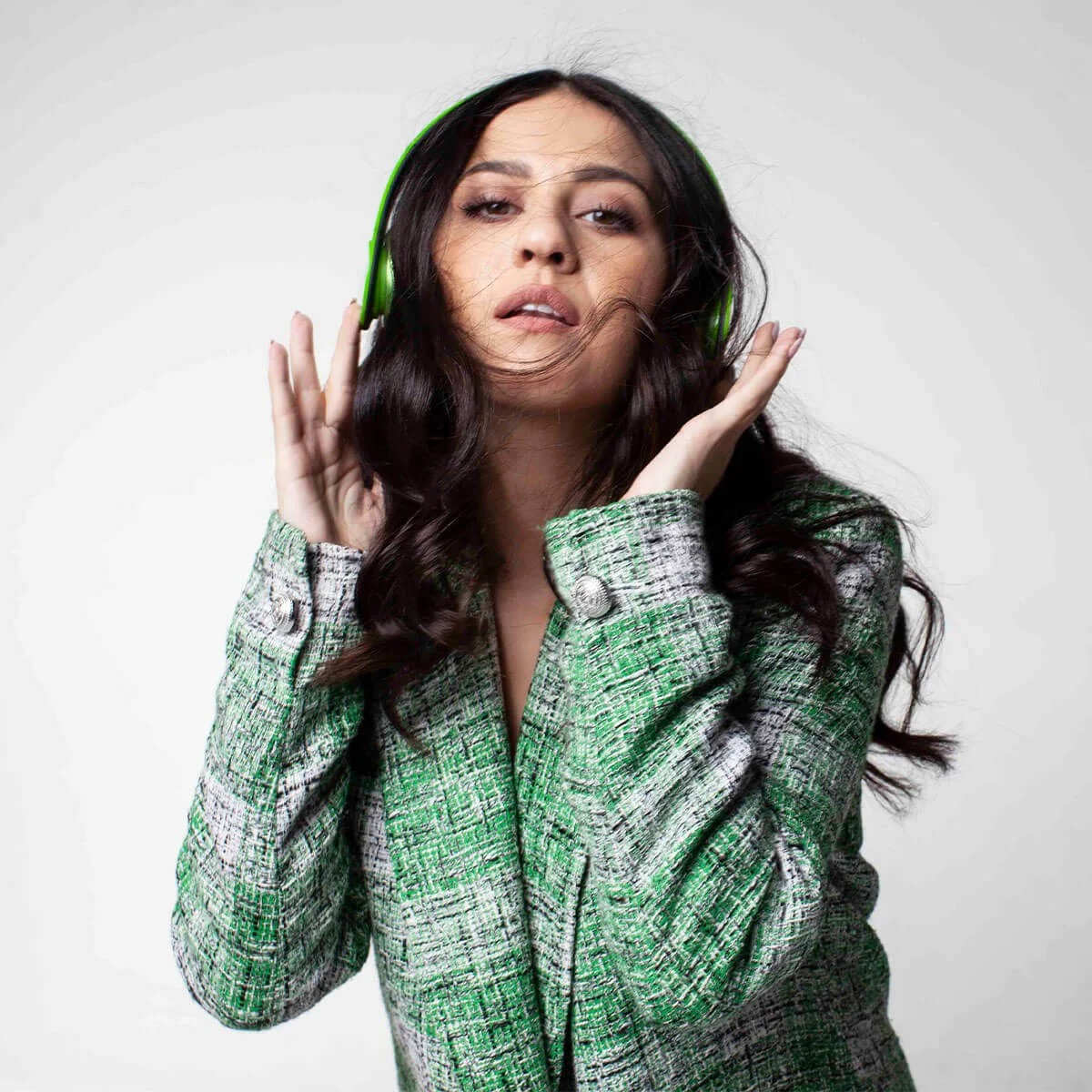 MINT campaign portrait with green headphones